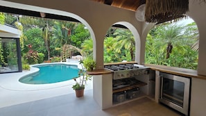 A kitchen with a gas stove, oven, and built-in microwave.