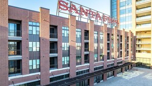 A multi-story building with a prominent sign reading 'SANTA FE.' - Landing | Stylish 1BD, Clubhouse (Tulsa)