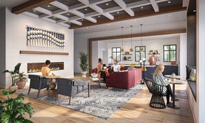 A spacious living area with a fireplace, a kitchen, and a dining area. - Landing | Chic 1BD, Gym, Yoga Studio (Murrieta)