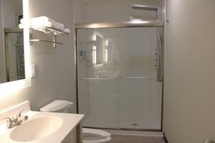 Suite, 1 King Bed, Jetted Tub (Guestroom) | Bathroom | Hair dryer, towels, soap, shampoo