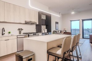 Fridge, dining tables - Landing | Chic 1BD, Gym, Courtyard (Houston)