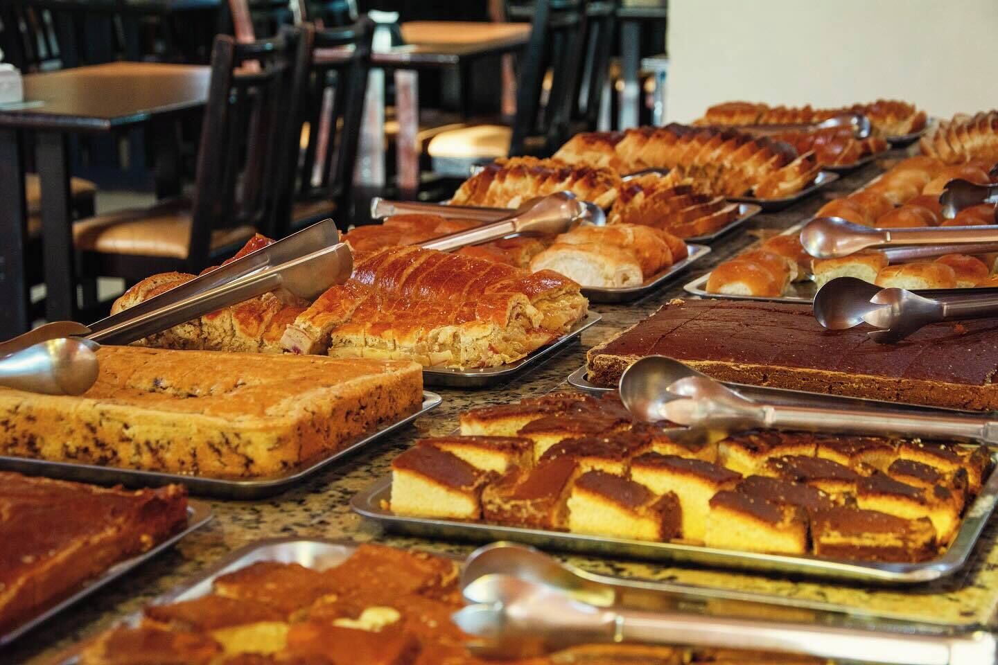 A buffet with various desserts and pastries.