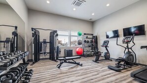 A gym with exercise equipment, a weight rack, and a treadmill. - Landing | Incredible 1BD, Gym, Clubhouse (Richland)