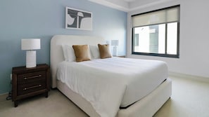 A bedroom with a bed, nightstands, a lamp, and a window. - Landing | Beautiful 2BD, Tennis Court, Pool (Houston)