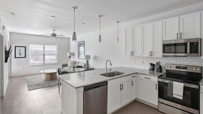 Fridge, dining tables - Landing | Chic 1BD, Pool, Gym (Athens)