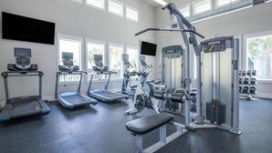 A gym with treadmills, a spin bike, and weight machines. - Landing | Spectacular 1BD, Gym, Clubhouse (Rockport)