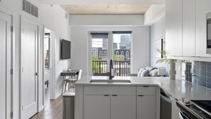 Fridge, dining tables - Landing | Chic 1BD, Pool, Yoga Studio (Nashville)