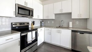 Fridge, dining tables - Landing | Spectacular 2BD, Gym (Fort Worth)