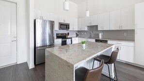Fridge, dining tables - Landing | Spectacular 2BD, Gym (Fort Worth)