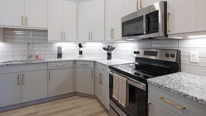 Fridge, dining tables - Landing | Modern 2BD, Courtyard, Gym (Addison)