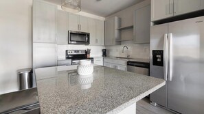 Fridge, dining tables - Landing | Modern 2BD, Gym (Saint Johns)