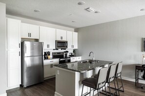 Fridge, dining tables - Landing | Modern 1BD, Pool, Gym (Palm Bay)