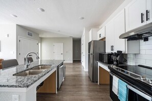 Fridge, dining tables - Landing | Stylish 1BD, Gym, Pool (Palm Bay)
