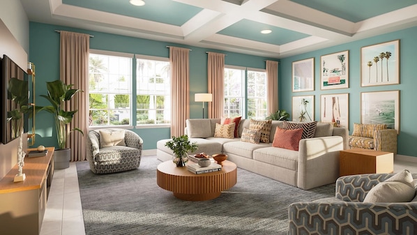 A living room with a sofa, armchairs, a coffee table, and a TV.