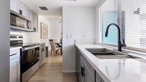 Fridge, dining tables - Landing | Stylish 1BD, Courtyard (Paradise)