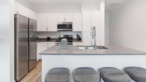 Fridge, dining tables - Landing | Stunning 2BD, Gym (North Las Vegas)