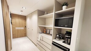 A modern kitchen with built-in appliances, a microwave, and a coffee maker. - Luxury, Family-Friendly Studio 1-0802A on the Beach! (Puerto Peñasco)