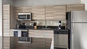 Fridge, dining tables - Landing | Chic 1BD, Yoga Studio, Gym (Clearwater)