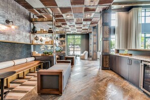 A modern kitchen with a wooden countertop, built-in appliances, and a view of the outdoors. - Landing | Incredible 2BD, Clubhouse, Gym (Lewisville)