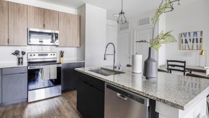 Fridge, dining tables - Landing | Incredible 2BD, Courtyard, Gym (Lewisville)