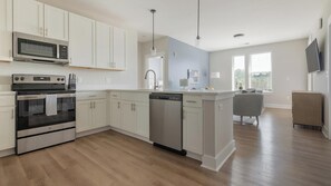 Fridge, dining tables - Landing | Beautiful 2BD, Yoga Studio, Gym (Hickory)