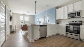 Fridge, dining tables - Landing | Stunning 2BD, Clubhouse, Yoga Studio (Hickory)