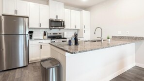 Fridge, dining tables - Landing | Modern 1BD, Gym (Port Royal)