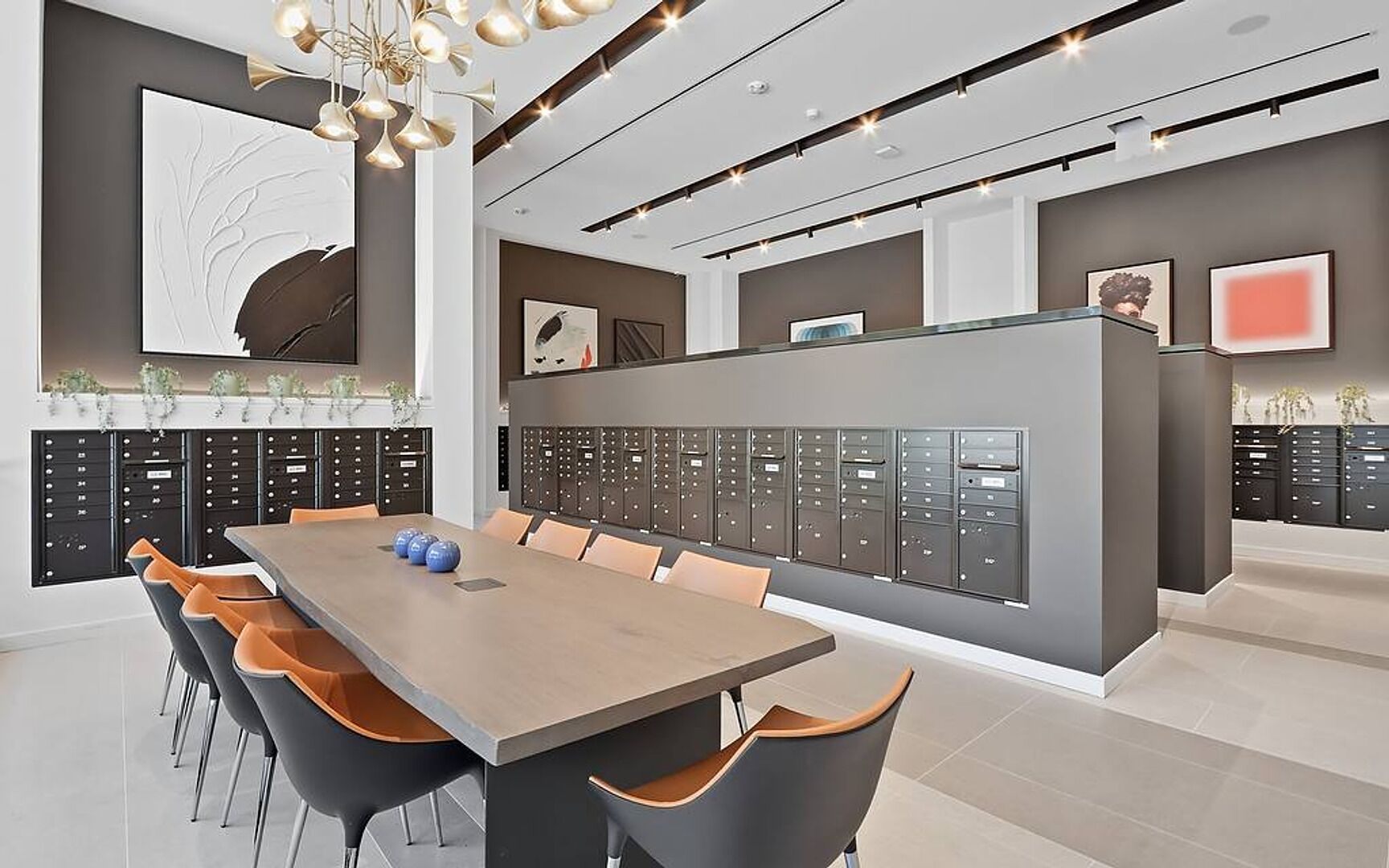 A modern conference room with a long table, chairs, and a row of filing cabinets.