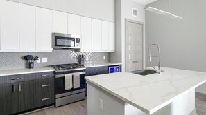 Fridge, dining tables - Landing | Chic 2BD, Gym (Houston)