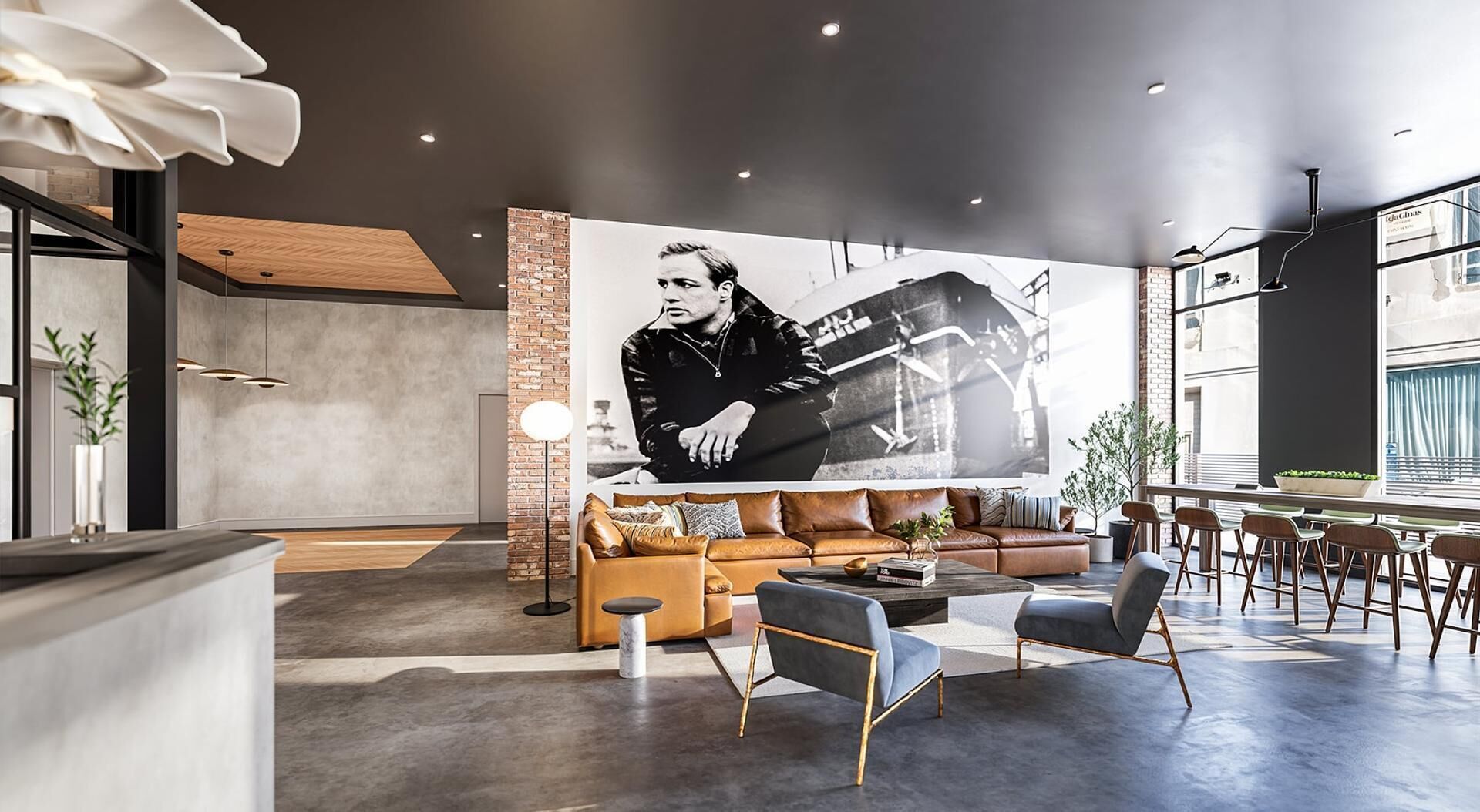 A modern interior with a large mural, leather sofas, and a bar area.