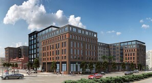 A multi-story building with a mix of brick and glass facades, large windows, and a pedestrian-friendly street with cars and people. - Landing | Chic 1BD, Pool (Philadelphia)
