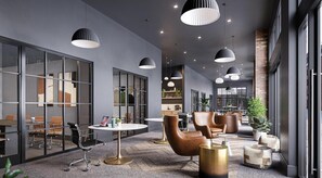 A modern interior with glass partitions, leather chairs, round tables, and pendant lighting. - Landing | Chic 1BD, Pool (Philadelphia)