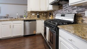 Fridge, dining tables - Landing | Chic 1BD, Courtyard, Gym (Columbia)
