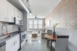 Fridge, dining tables - Landing | Amazing 1BD, Game Room, Rooftop Lounge (Bellview)