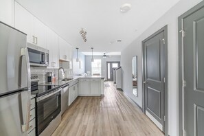 Fridge, dining tables - Landing | Stylish 2BD, Rooftop Lounge, Game Room (Bellview)