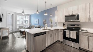 Fridge, dining tables - Landing | Chic 1BD in Bricktown (Fort Worth)