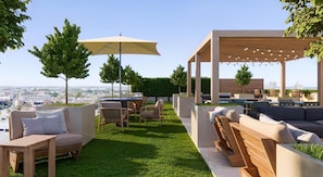 A rooftop patio with outdoor furniture, a pergola with string lights, and a view of the cityscape. - Landing | Incredible Studio in Lincoln Park (Chicago)