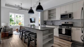 Fridge, dining tables - Landing | Spectacular 2BD, Gym (Austin)