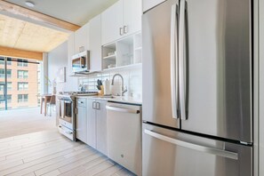 Fridge, dining tables - Landing | Modern 1BD, Game Room, Gym (Milwaukee)