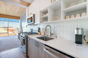 Fridge, dining tables - Landing | Chic 1BD, Pool, Gym (Milwaukee)