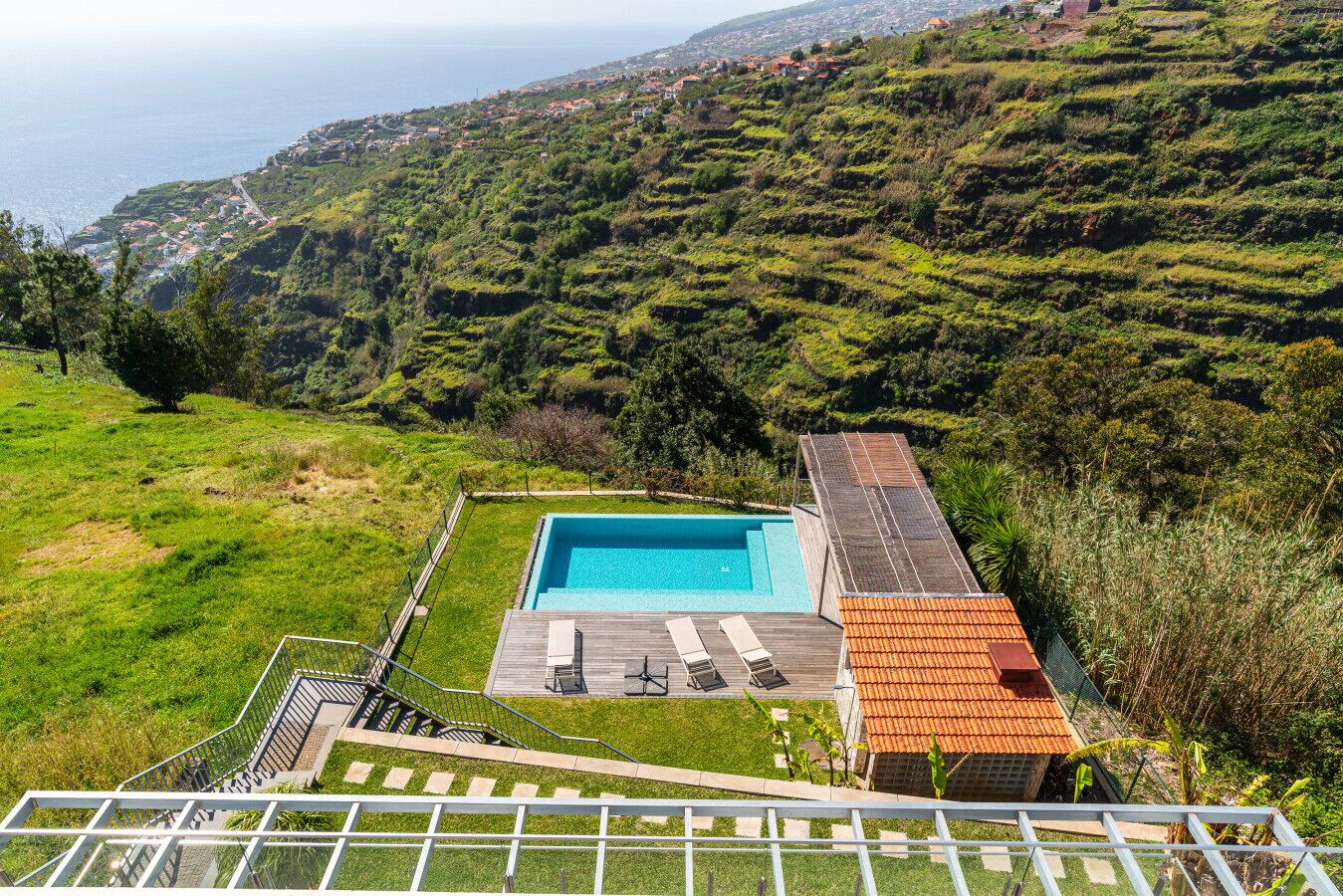 Infinity pool set into Calheta’s dramatic hillside.