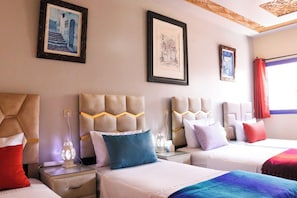 Comfort Quadruple Room, Patio, Garden View | Memory foam beds, free minibar items, blackout drapes, soundproofing
