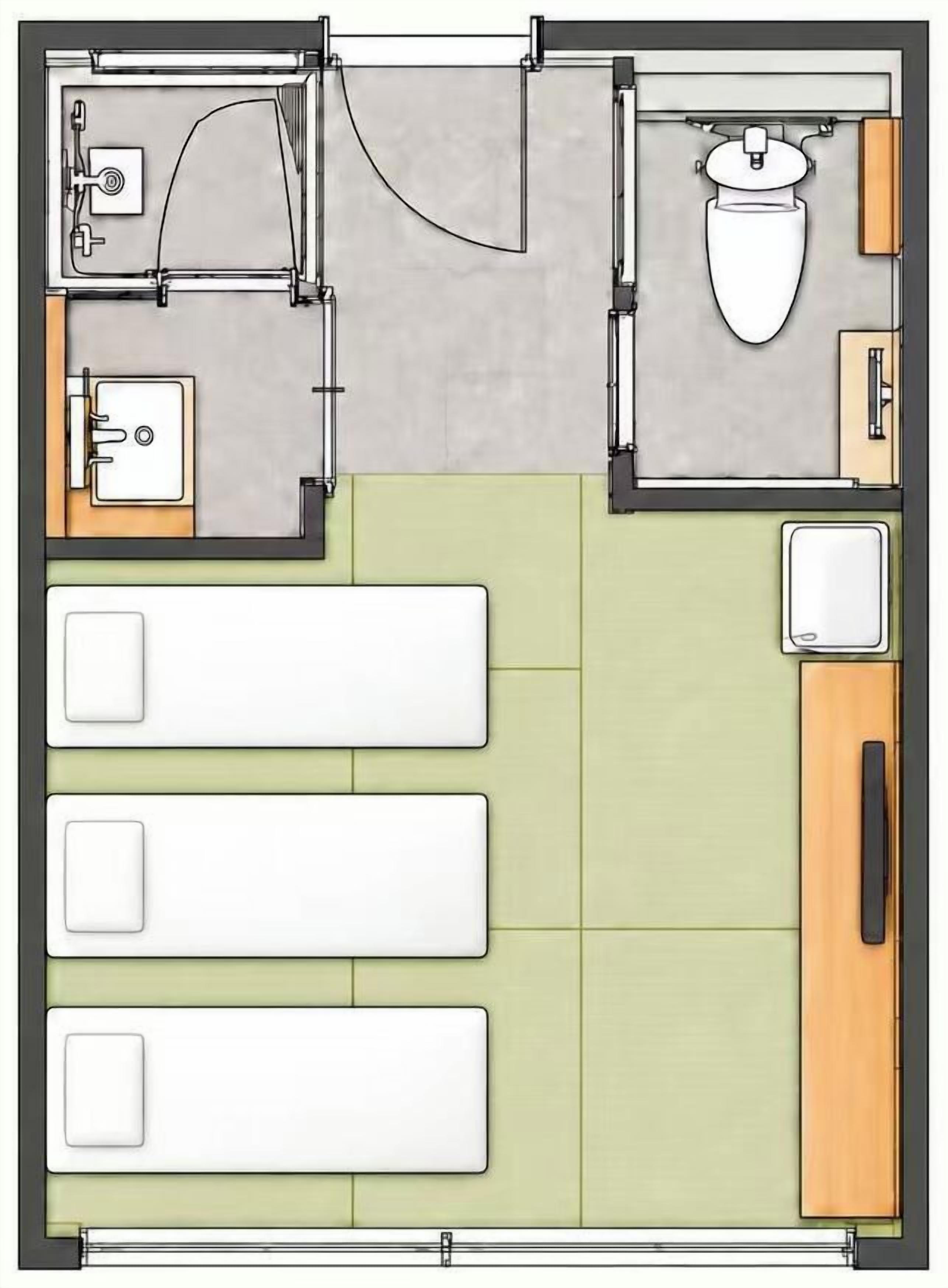 A hotel room layout with a bed, a small bathroom, and a kitchenette.