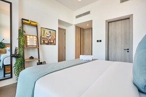Unwind in a cozy bedroom with a private bathroom and built-in clothing storage—designed for comfort, privacy, and ease. Located near Circle Mall for convenient shopping and dining options✨ - Elegant 1-Bedroom Apartment in Dubai (Dubai)