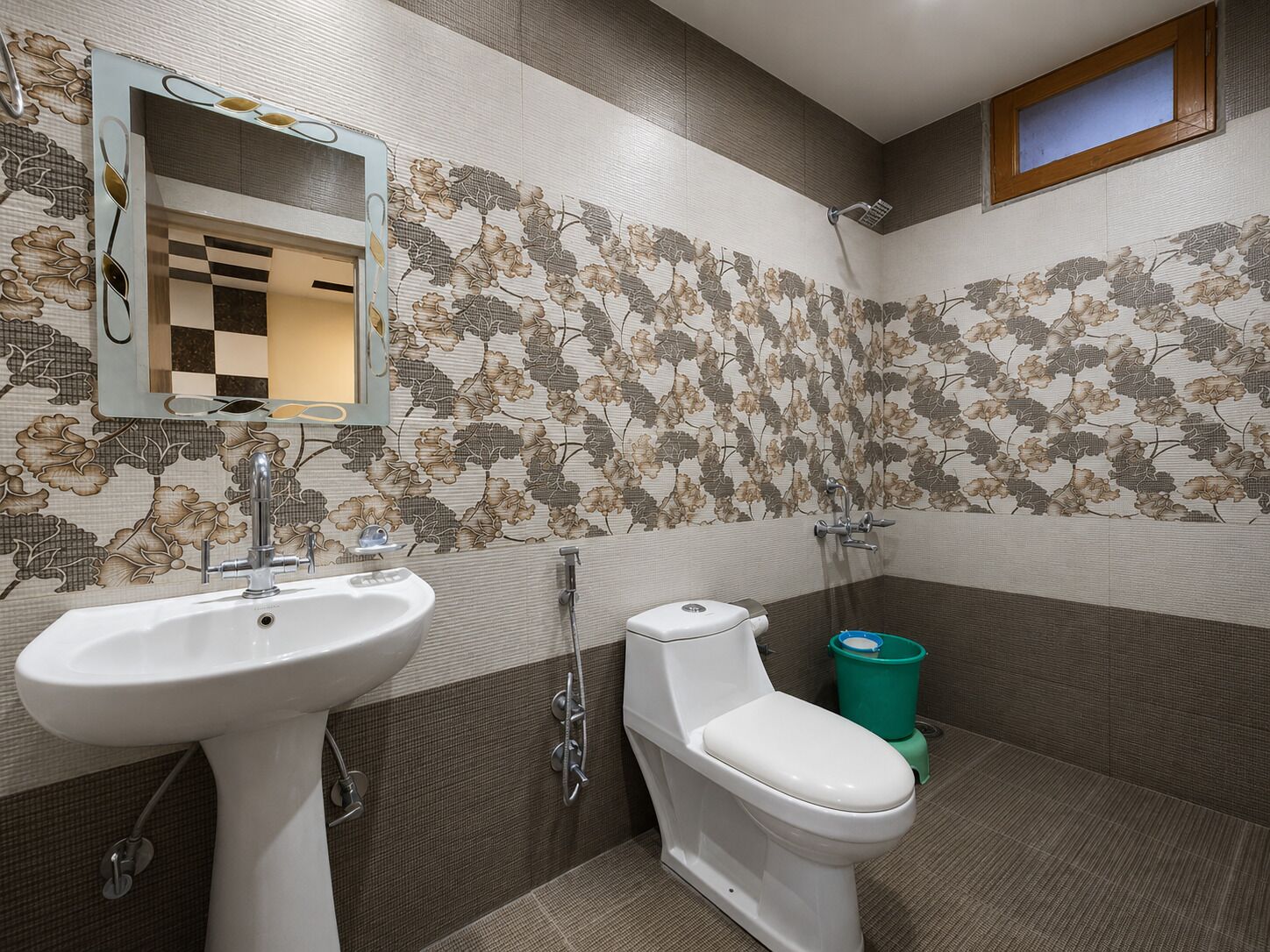 A bathroom with a sink, toilet, and shower.