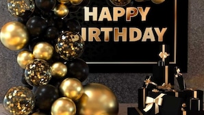 A black and gold birthday decoration with a 'HAPPY BIRTHDAY' sign. - The Cambrian Village Hotel and Resort (Nyamira)
