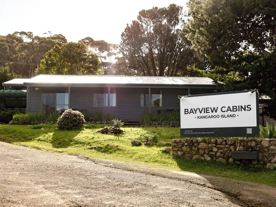 A cabin with a signboard indicating 'Bayview Cabins' located on Kangaroo Island.