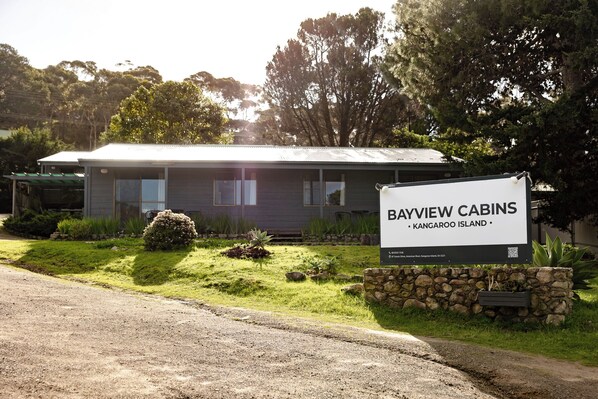 A cabin with a signboard indicating 'Bayview Cabins' located on Kangaroo Island.