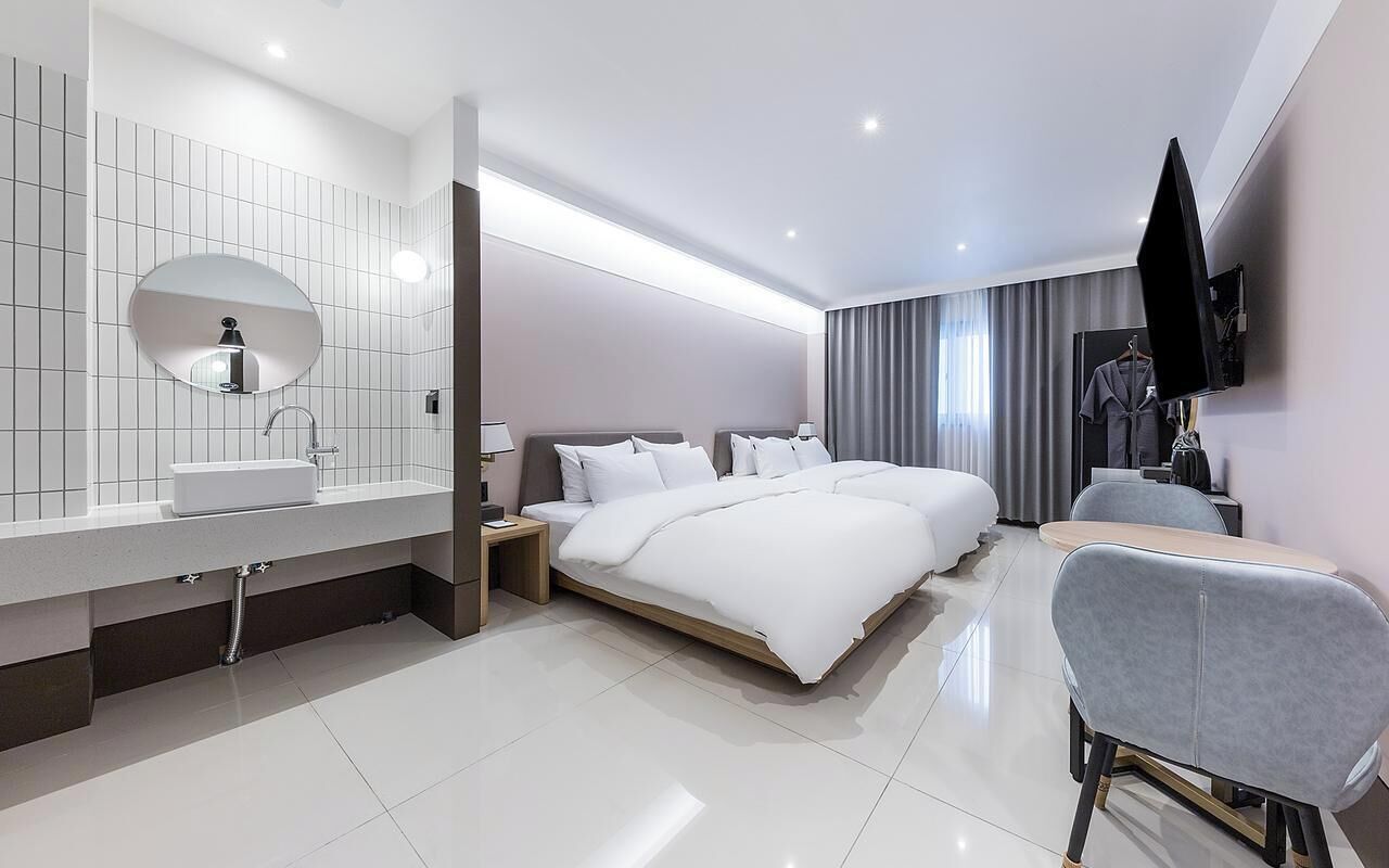 Premium bedding, down duvets, desk, laptop workspace