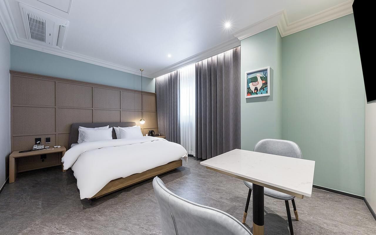 Premium bedding, down duvets, desk, laptop workspace